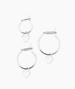sterling silver huggie hoops with dangling heart charms