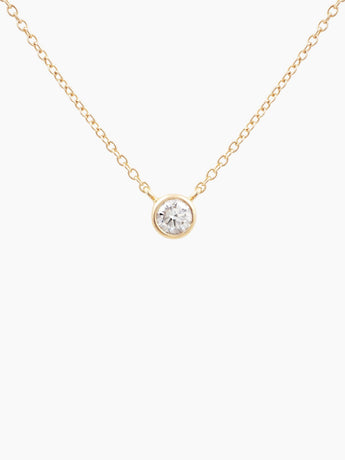 Gold necklace with a 1/4ct diamond pendant on a white background