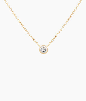 Gold necklace with a 1/8ct diamond pendant on a white background