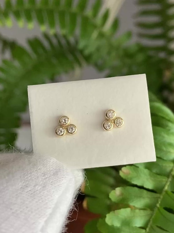 14k solid gold studs with a trio of diamonds