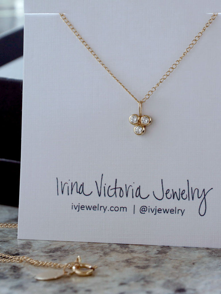 14k gold three stone diamond pendant necklace